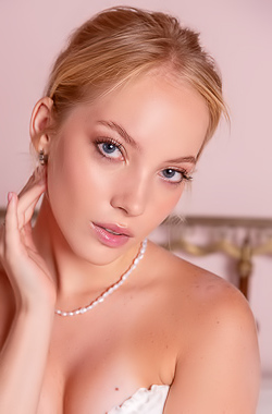 Bella Spark On The Bed In A White Corset